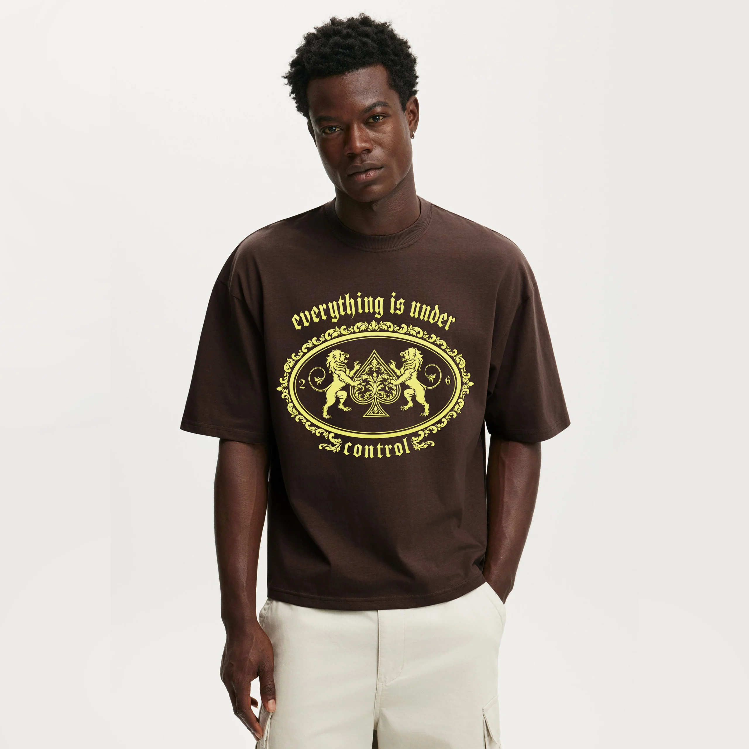 Control model wearing a graphic brown tee